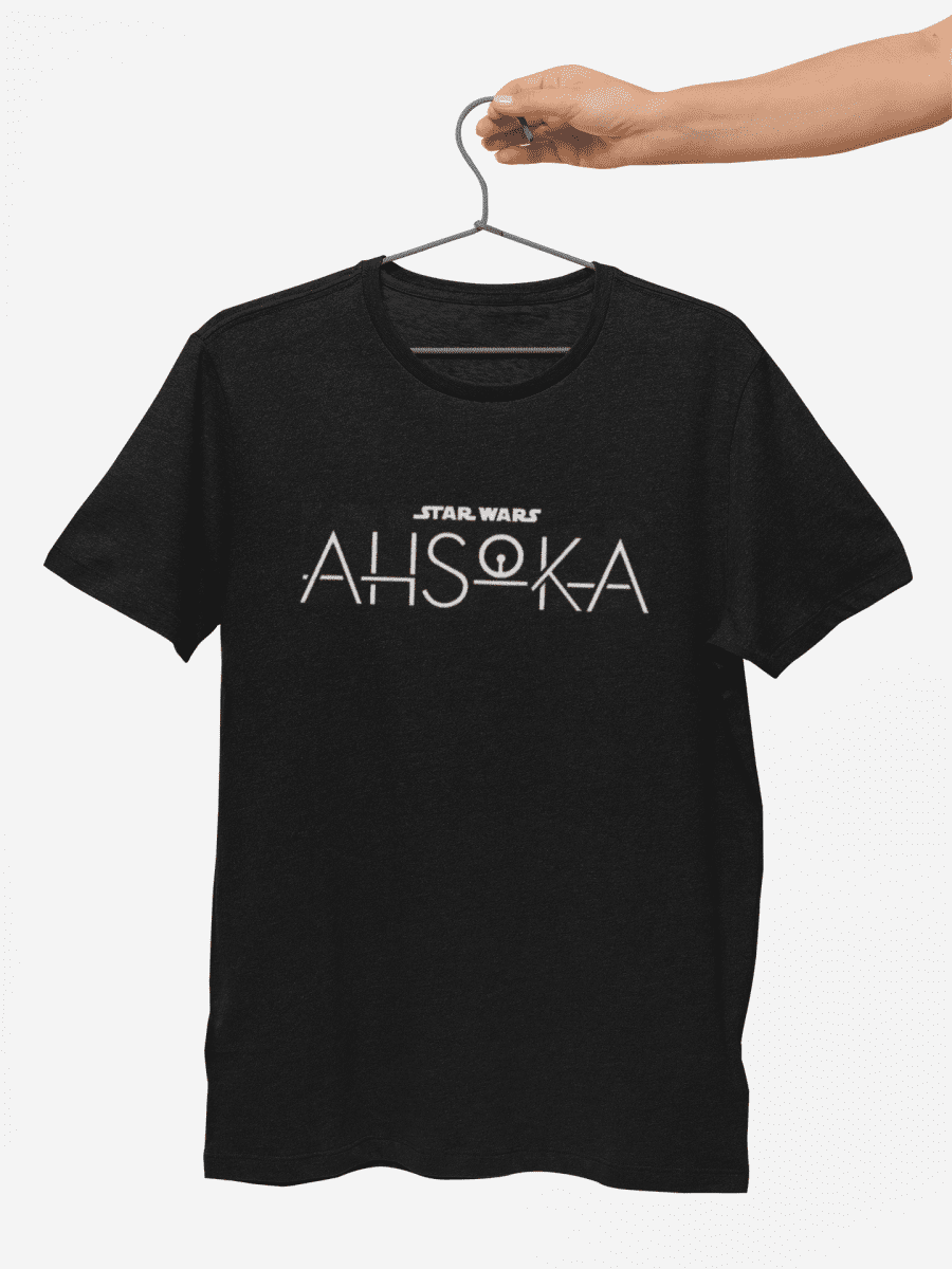 mockup-of-a-hand-holding-a-t-shirt-against-a-minimalist-background-27687 (1)